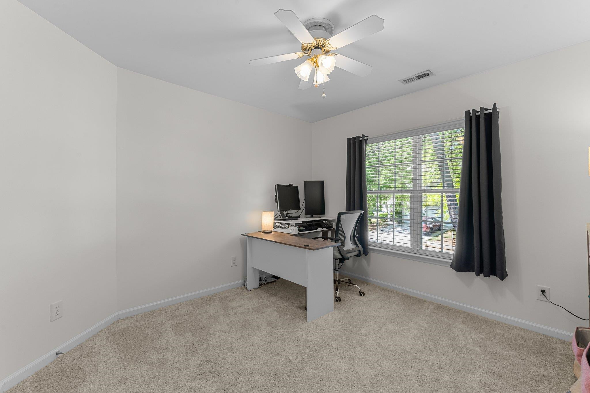 8411 Tie Stone Way Raleigh, NC 27613 - Photo 26 of 38 a view of a workspace with furniture and a window