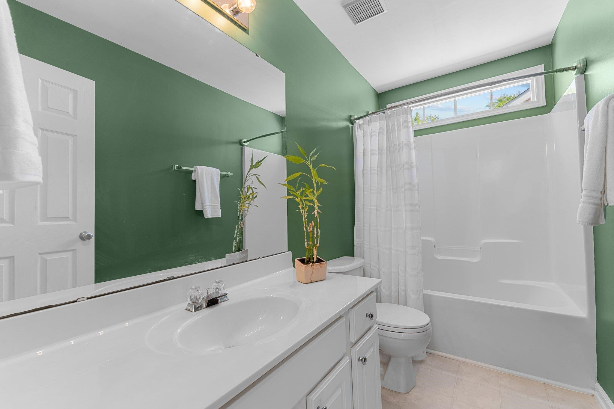 8411 Tie Stone Way Raleigh, NC 27613 - Photo 27 of 38 a bathroom with a sink a toilet and shower