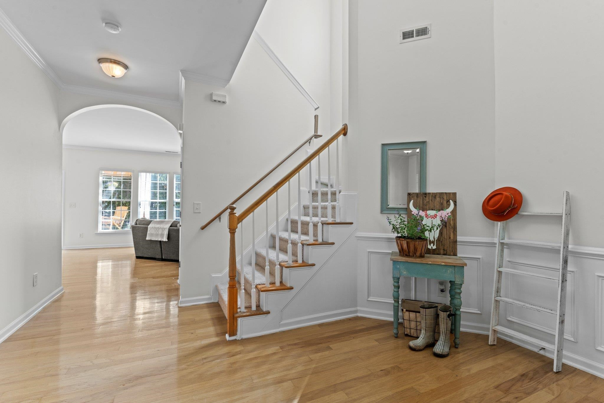 8411 Tie Stone Way Raleigh, NC 27613 - Photo 7 of 38 a view of entryway and hall with wooden floor