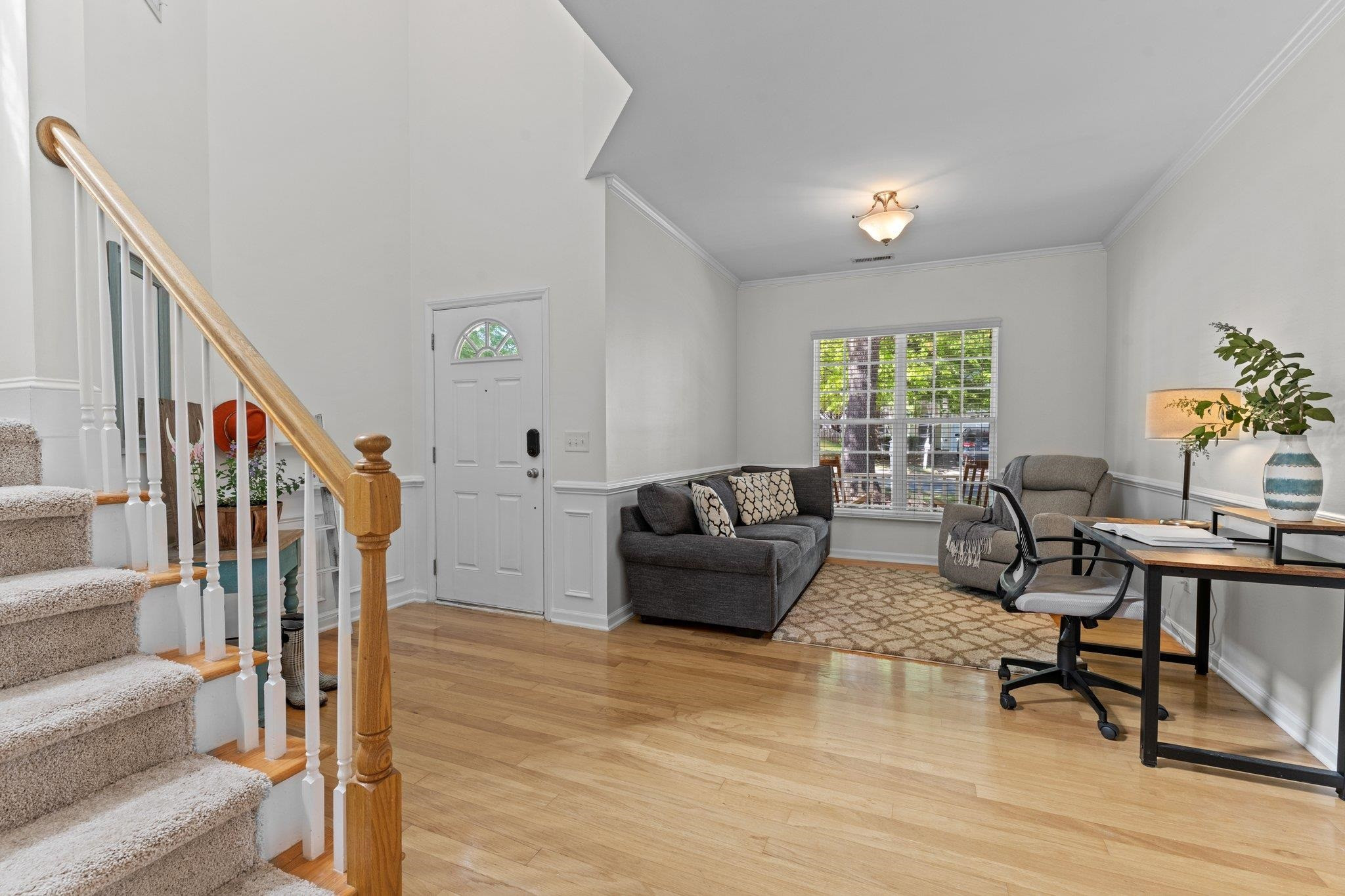 8411 Tie Stone Way Raleigh, NC 27613 - Photo 9 of 38 a living room with furniture and a wooden floor