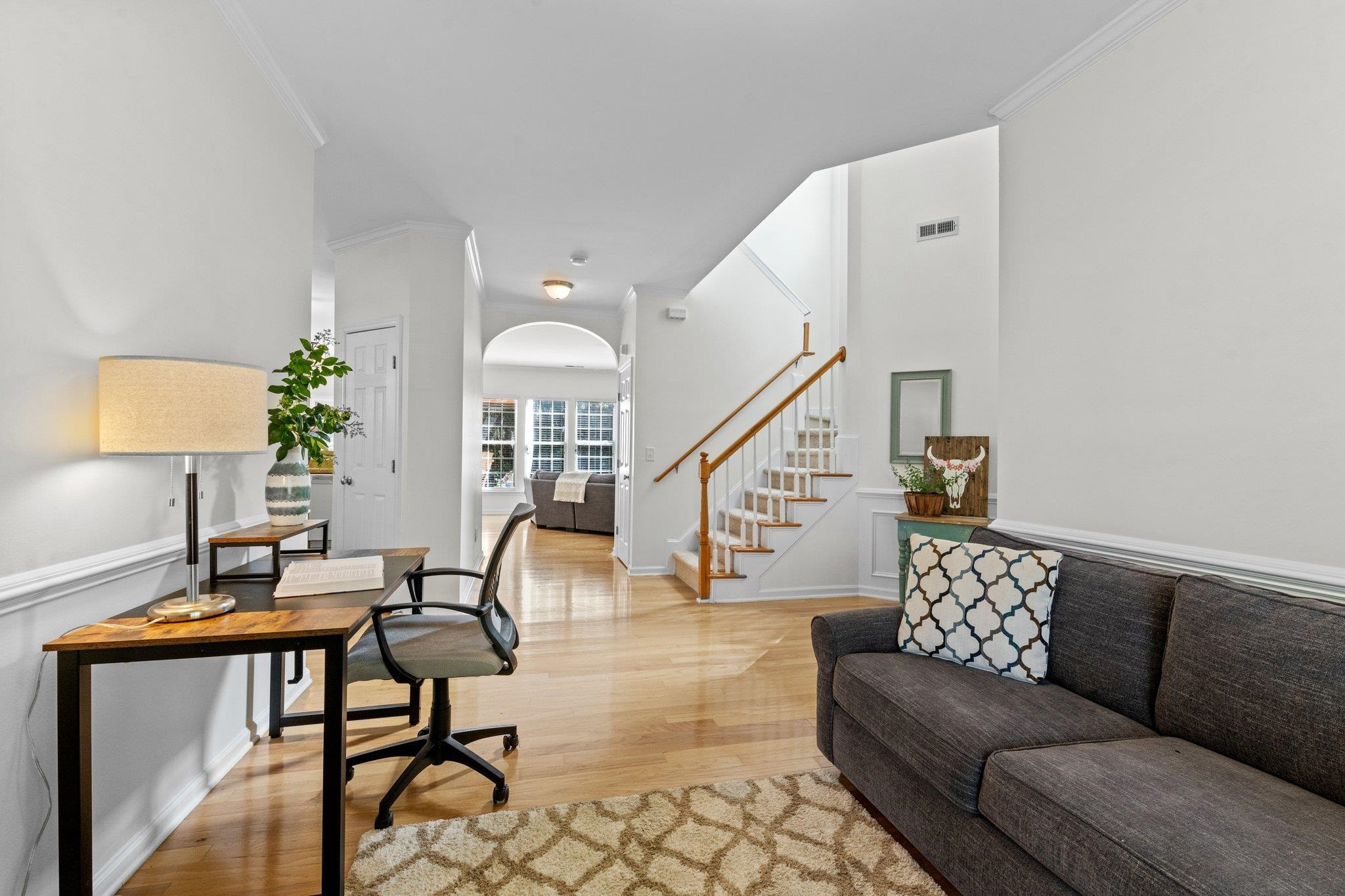 8411 Tie Stone Way Raleigh, NC 27613 - Photo 10 of 38 a living room with furniture and wooden floor