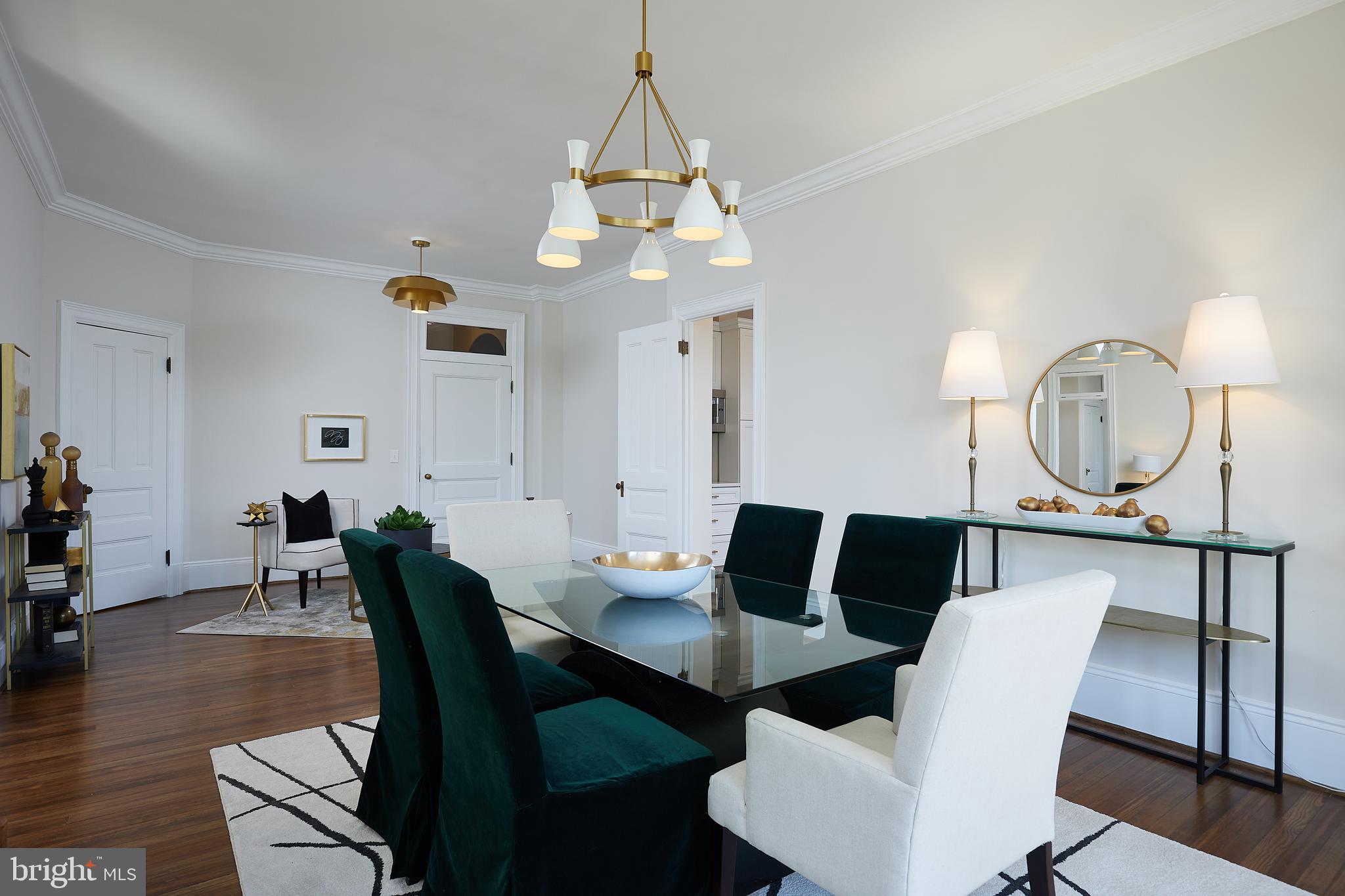 2853 Ontario Road Northwest, Unit 323 Washington, DC 20009 - Photo 13 of 66 a view of a dining room with furniture and wooden floor