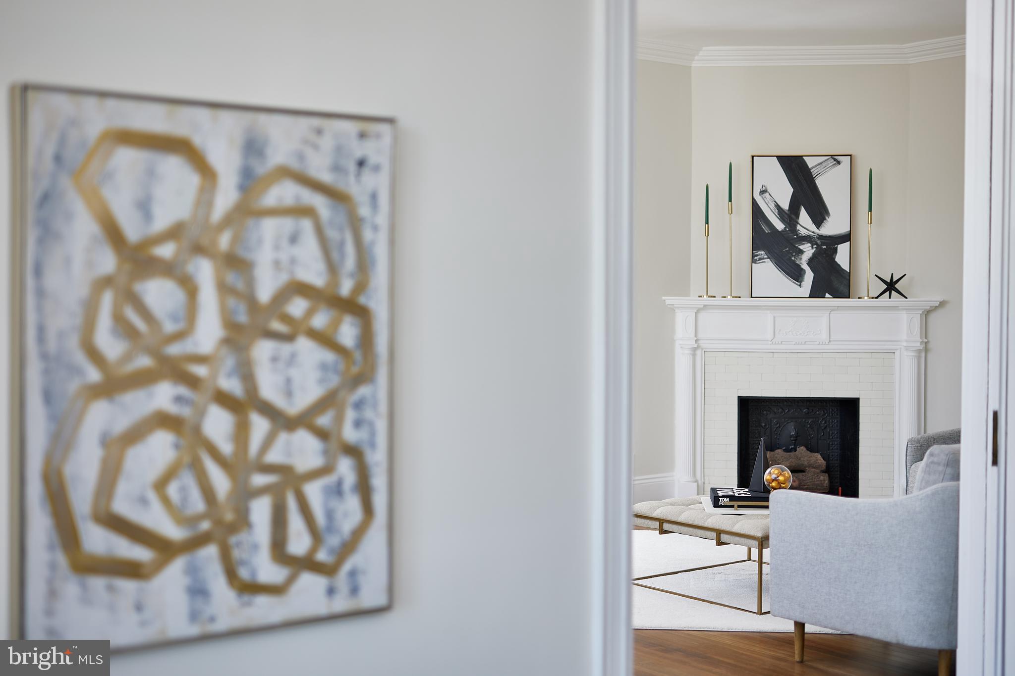 2853 Ontario Road Northwest, Unit 323 Washington, DC 20009 - Photo 15 of 66 a living room with furniture and a fireplace