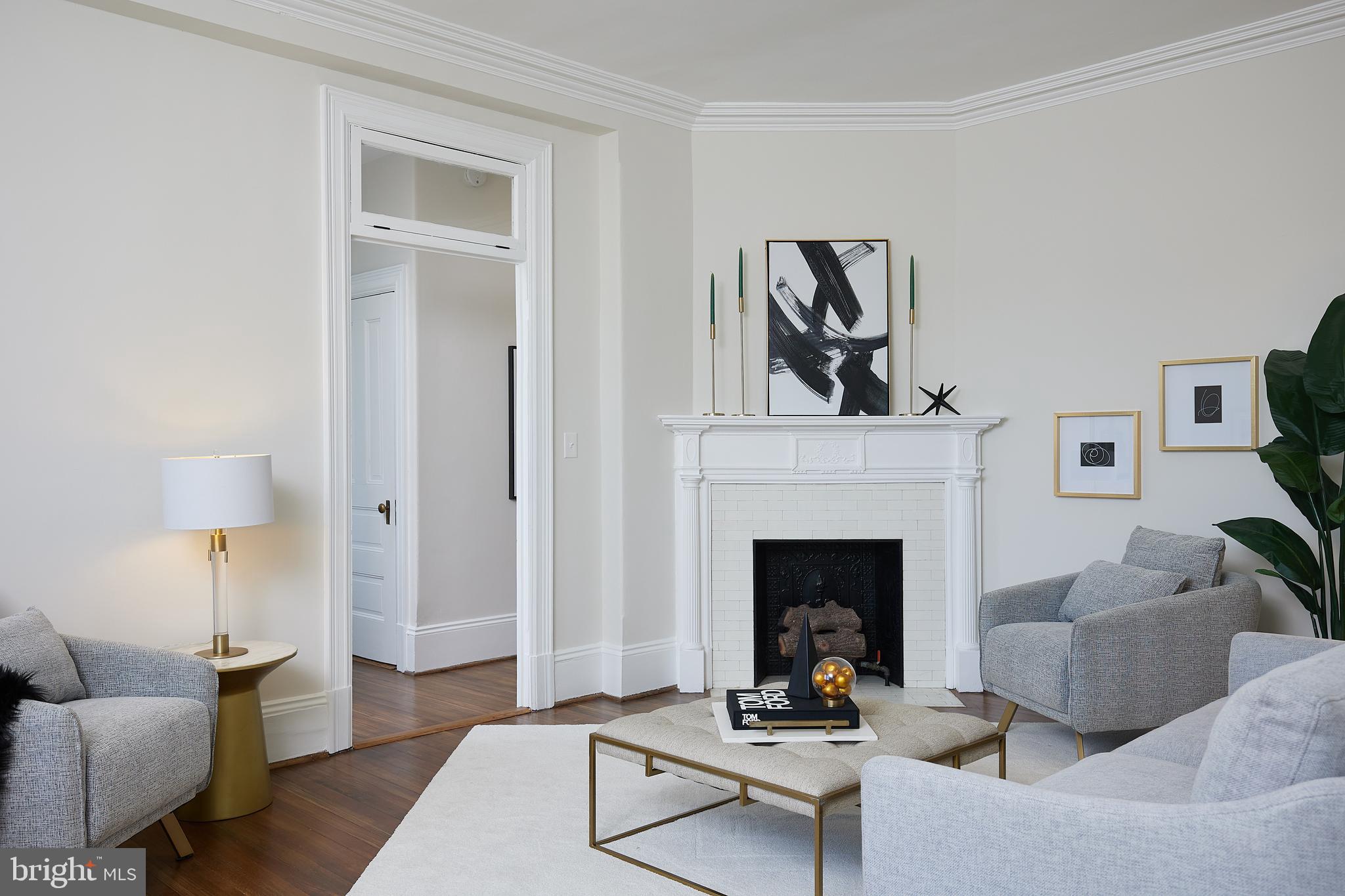2853 Ontario Road Northwest, Unit 323 Washington, DC 20009 - Photo 16 of 66 a living room with furniture and a fireplace