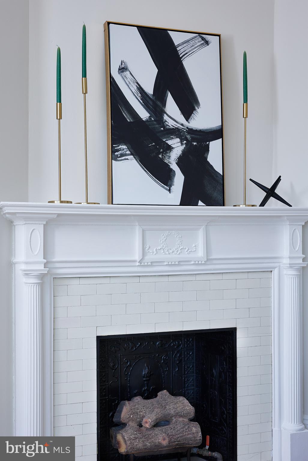 2853 Ontario Road Northwest, Unit 323 Washington, DC 20009 - Photo 20 of 66 a close view of a fireplace with wooden floor