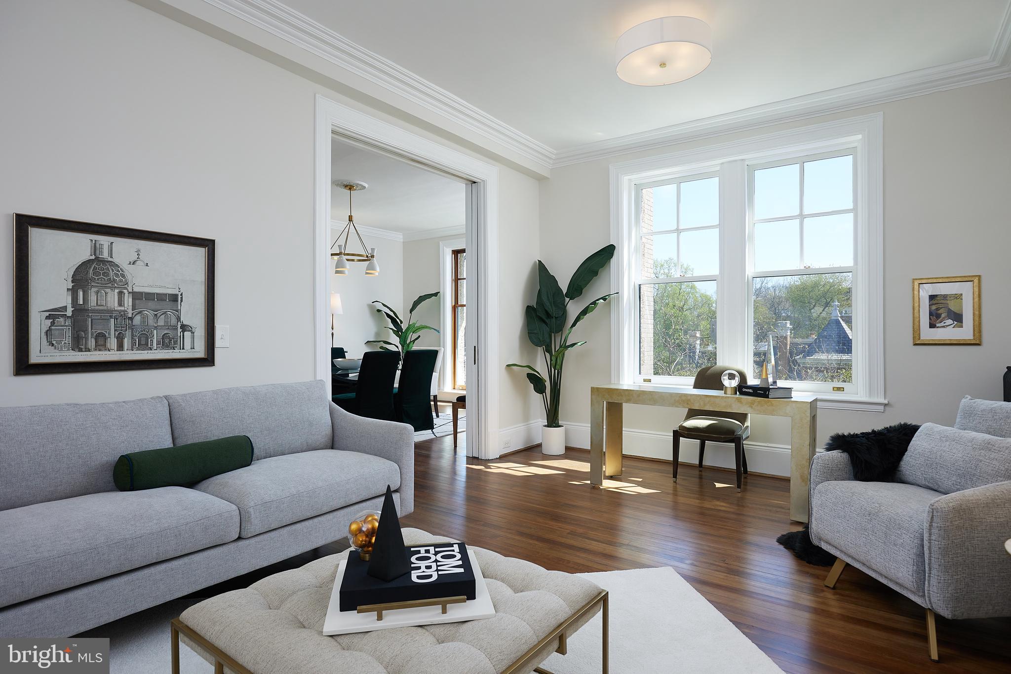 2853 Ontario Road Northwest, Unit 323 Washington, DC 20009 - Photo 22 of 66 a living room with furniture and a large window