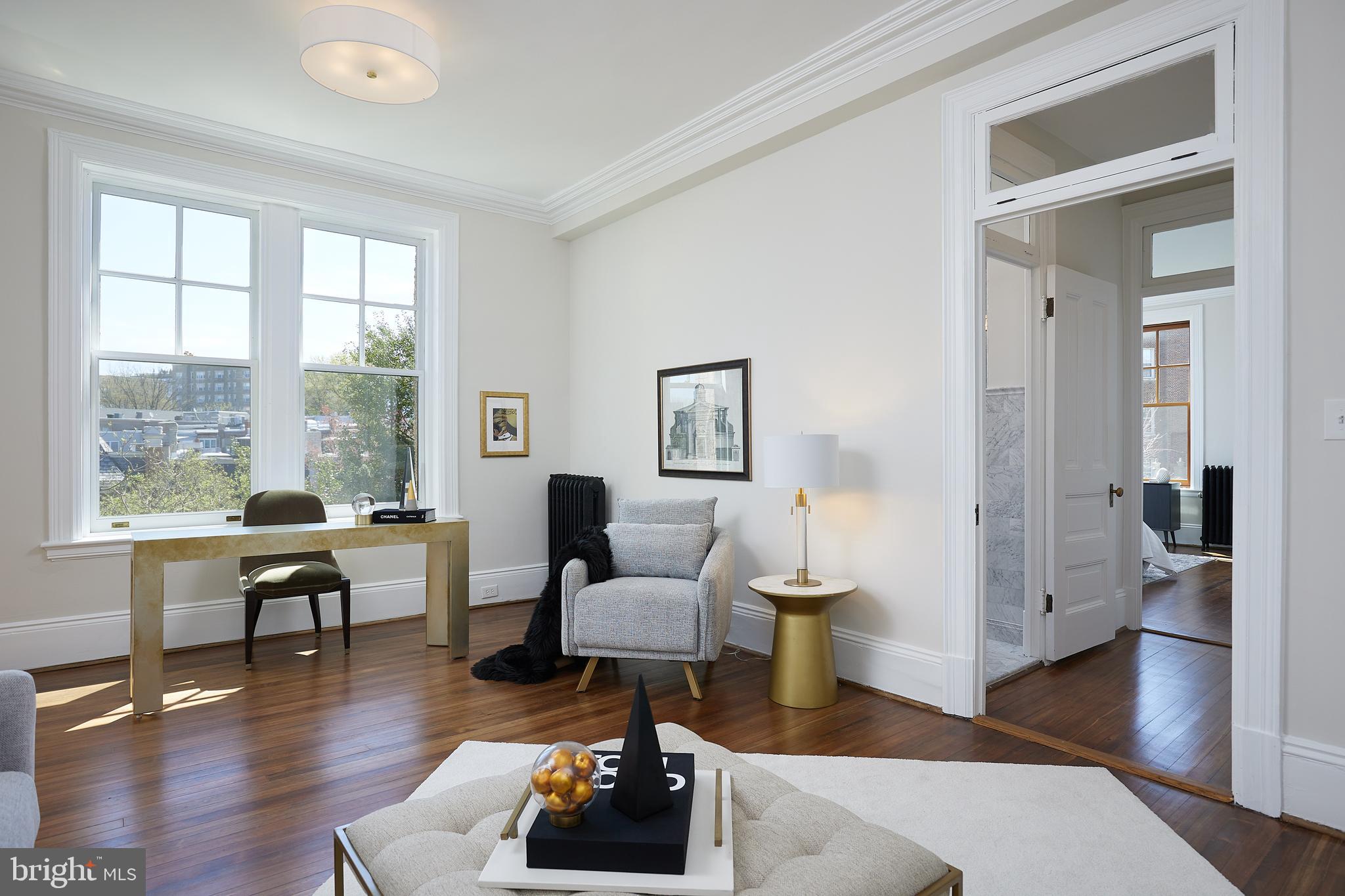 2853 Ontario Road Northwest, Unit 323 Washington, DC 20009 - Photo 24 of 66 a living room with furniture and wooden floor