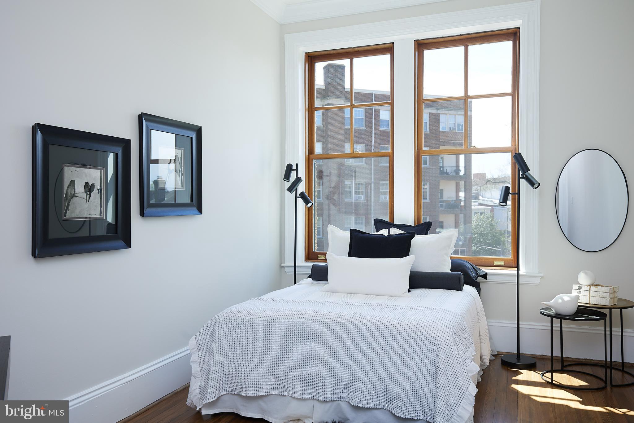 2853 Ontario Road Northwest, Unit 323 Washington, DC 20009 - Photo 39 of 66 a bedroom with a bed and a window