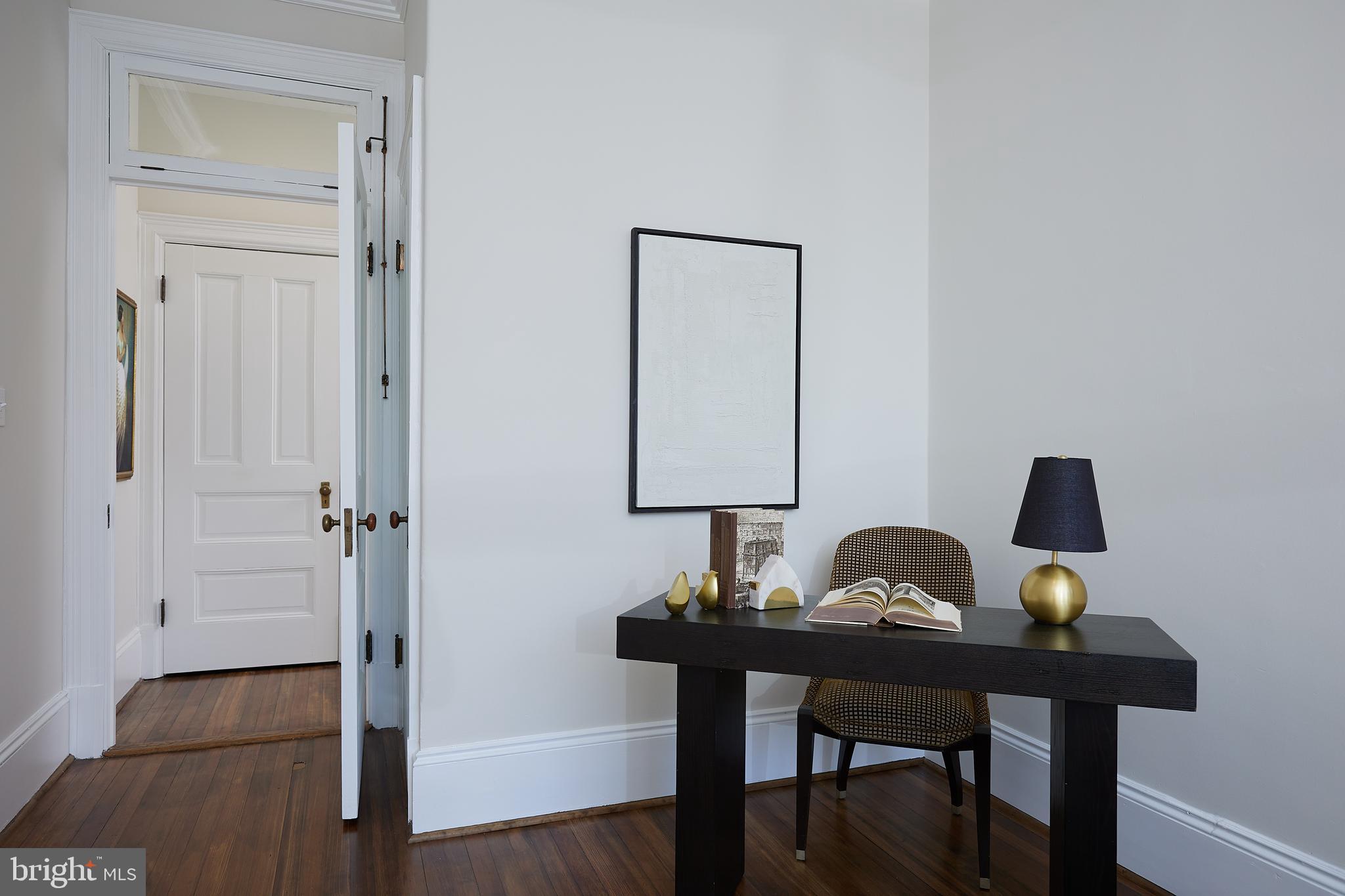2853 Ontario Road Northwest, Unit 323 Washington, DC 20009 - Photo 41 of 66 a view of a workspace with furniture and wooden floor