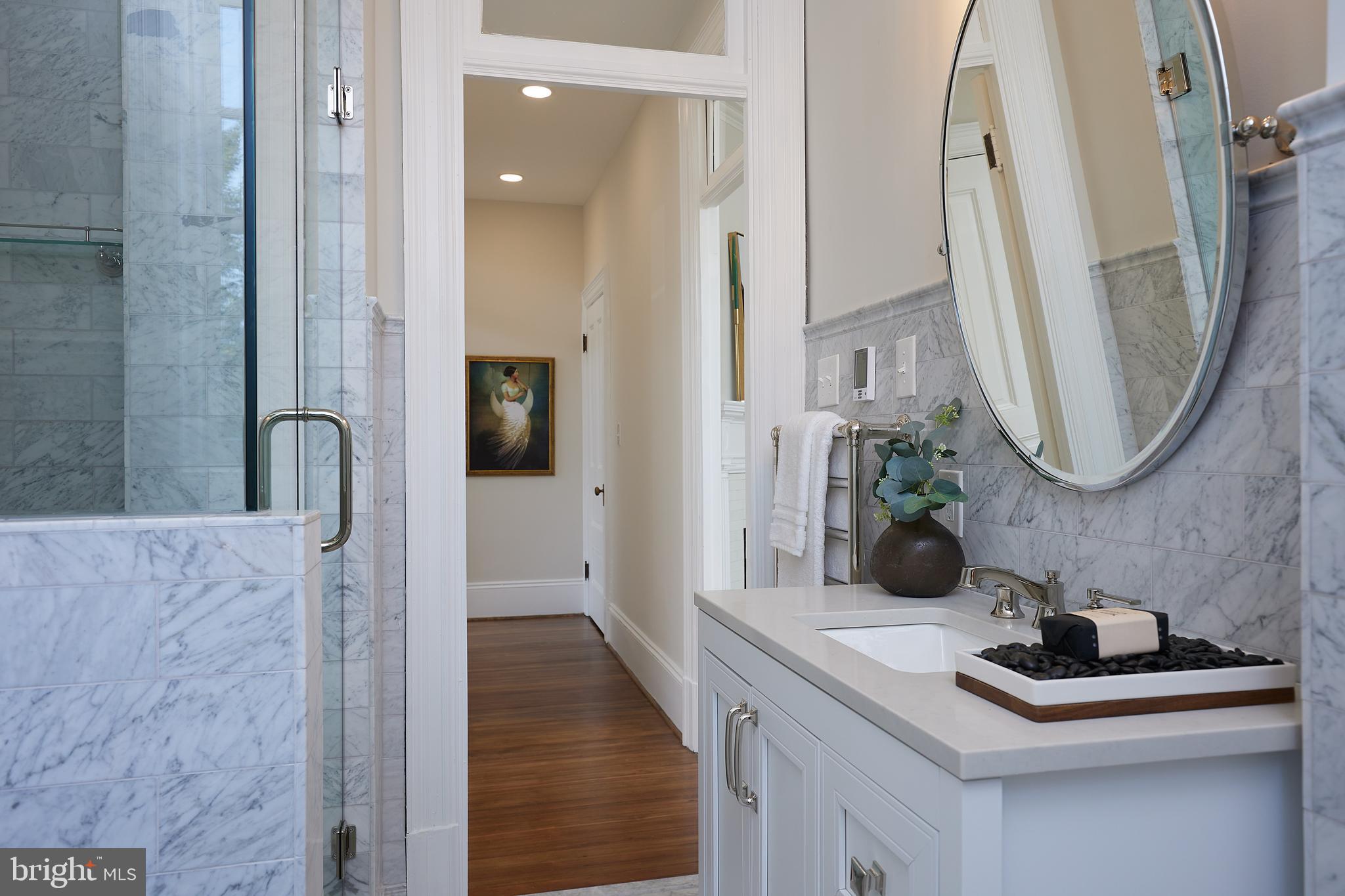 2853 Ontario Road Northwest, Unit 323 Washington, DC 20009 - Photo 46 of 66 a bathroom with a sink and a mirror