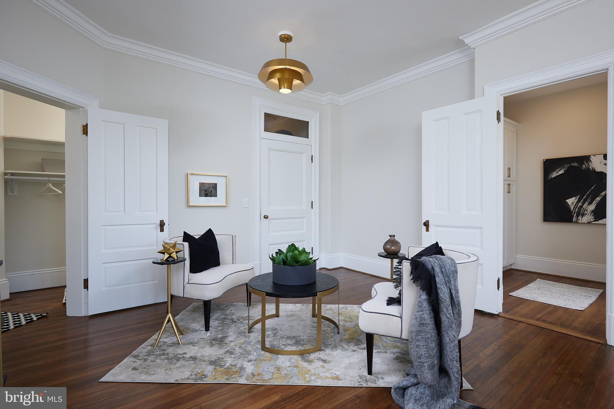 2853 Ontario Road Northwest, Unit 323 Washington, DC 20009 - Photo 5 of 66 a living room with furniture and wooden floor