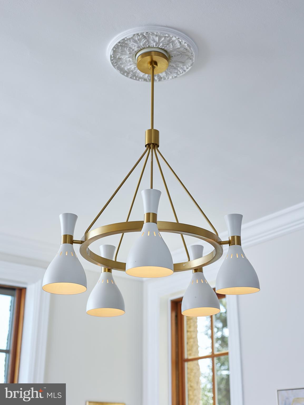 2853 Ontario Road Northwest, Unit 323 Washington, DC 20009 - Photo 10 of 66 a room with a table and a chandelier