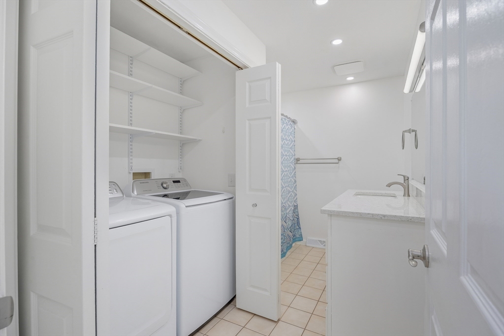 2 Pine Grove Drive, Unit 2 South Hadley, MA 01075 - Photo 23 of 34 a bathroom with a sink toilet and vanity