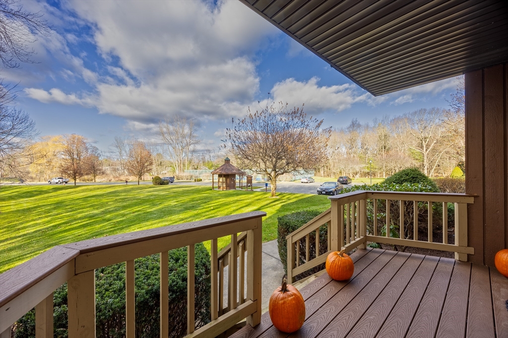 2 Pine Grove Drive, Unit 2 South Hadley, MA 01075 - Photo 31 of 34 a balcony with wooden floor table and chairs