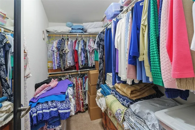 a view of a bedroom with a bed