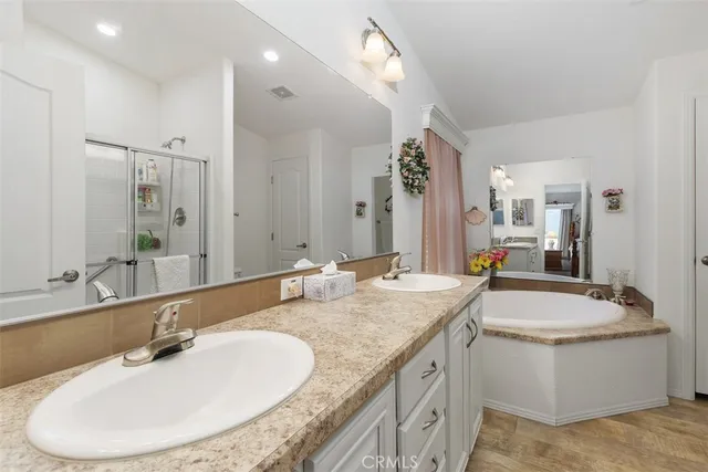 a bathroom with a granite countertop sink a toilet and a mirror