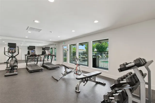 a kitchen with stainless steel appliances granite countertop a sink stove oven and refrigerator