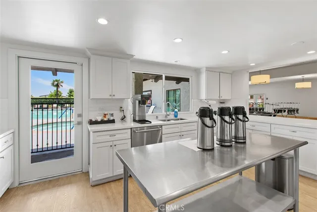 a kitchen with stainless steel appliances granite countertop a stove a refrigerator and a refrigerator