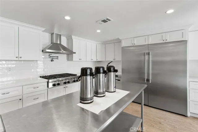 an outdoor space with swimming pool and furniture