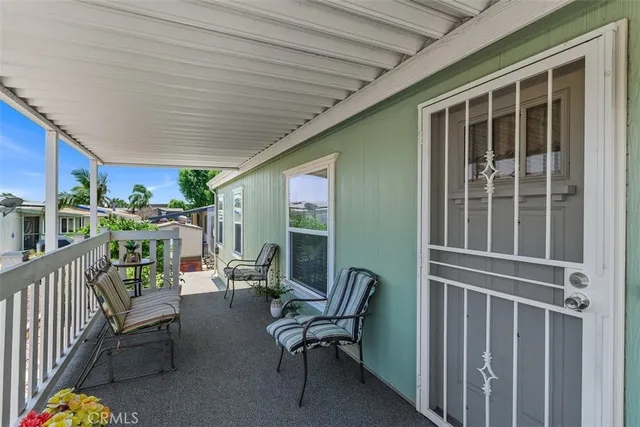 a balcony with furniture and garden view