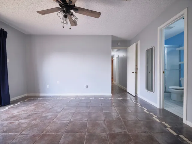a bathroom with a sink toilet and mirror