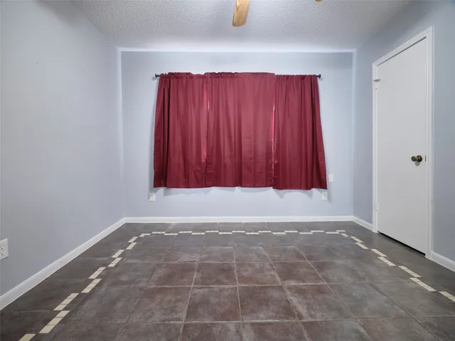 a view of room with window and hardwood floor