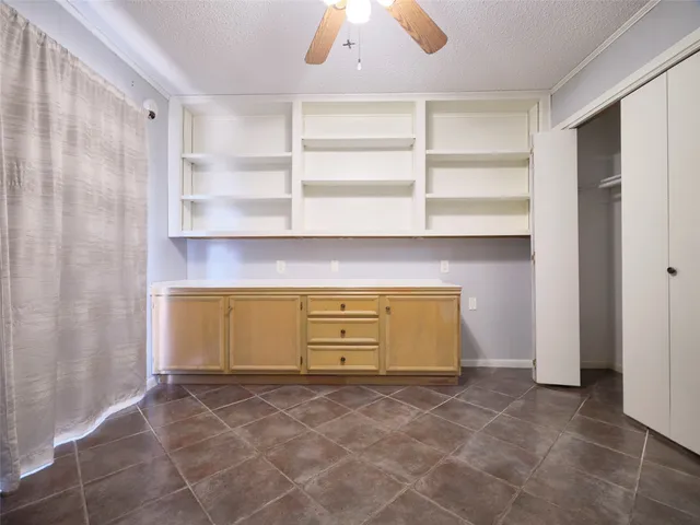 a view of room with cabinets
