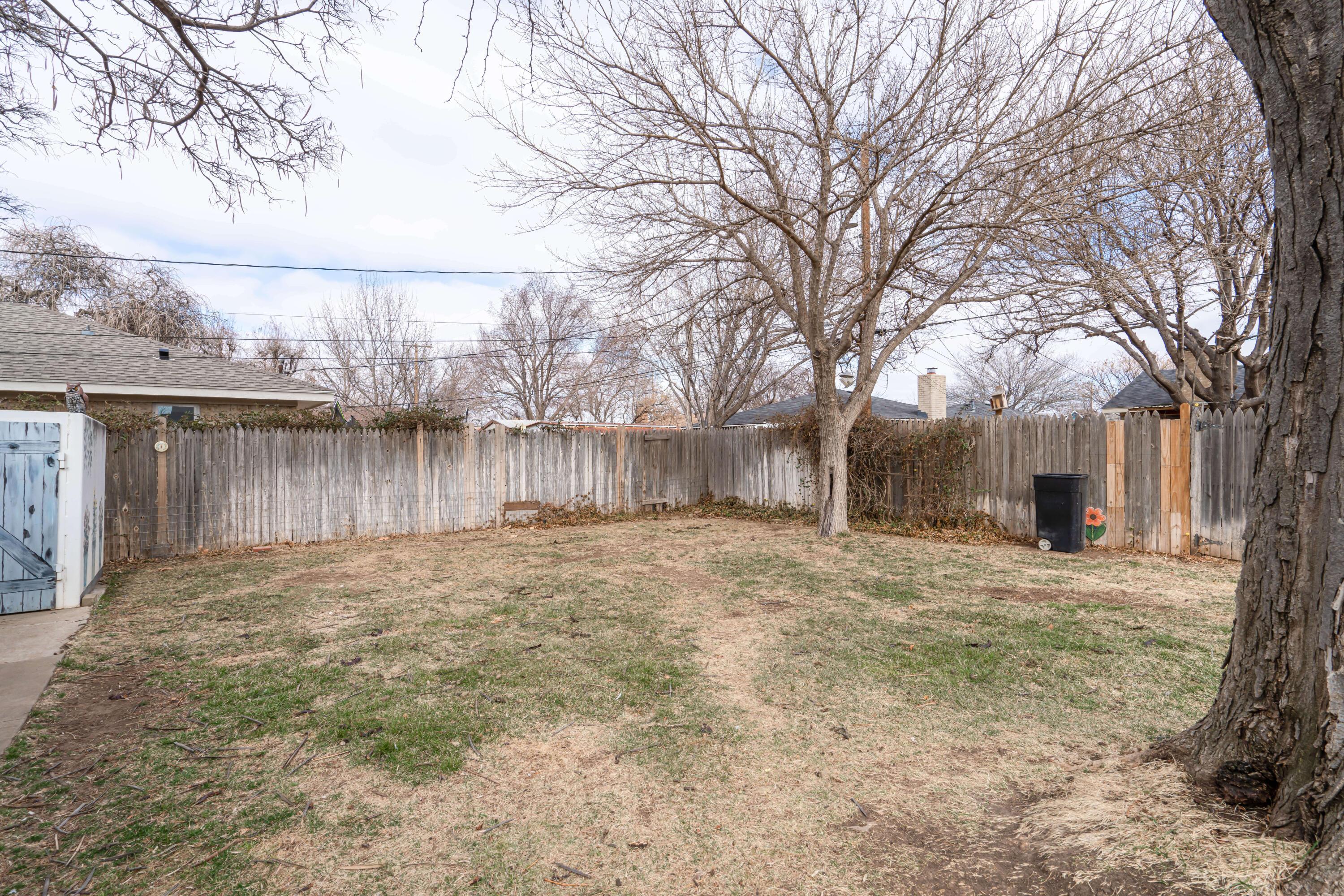 4513 Mesa Circle Amarillo, TX 79109 - Photo 16 of 18 a view of a yard with a house