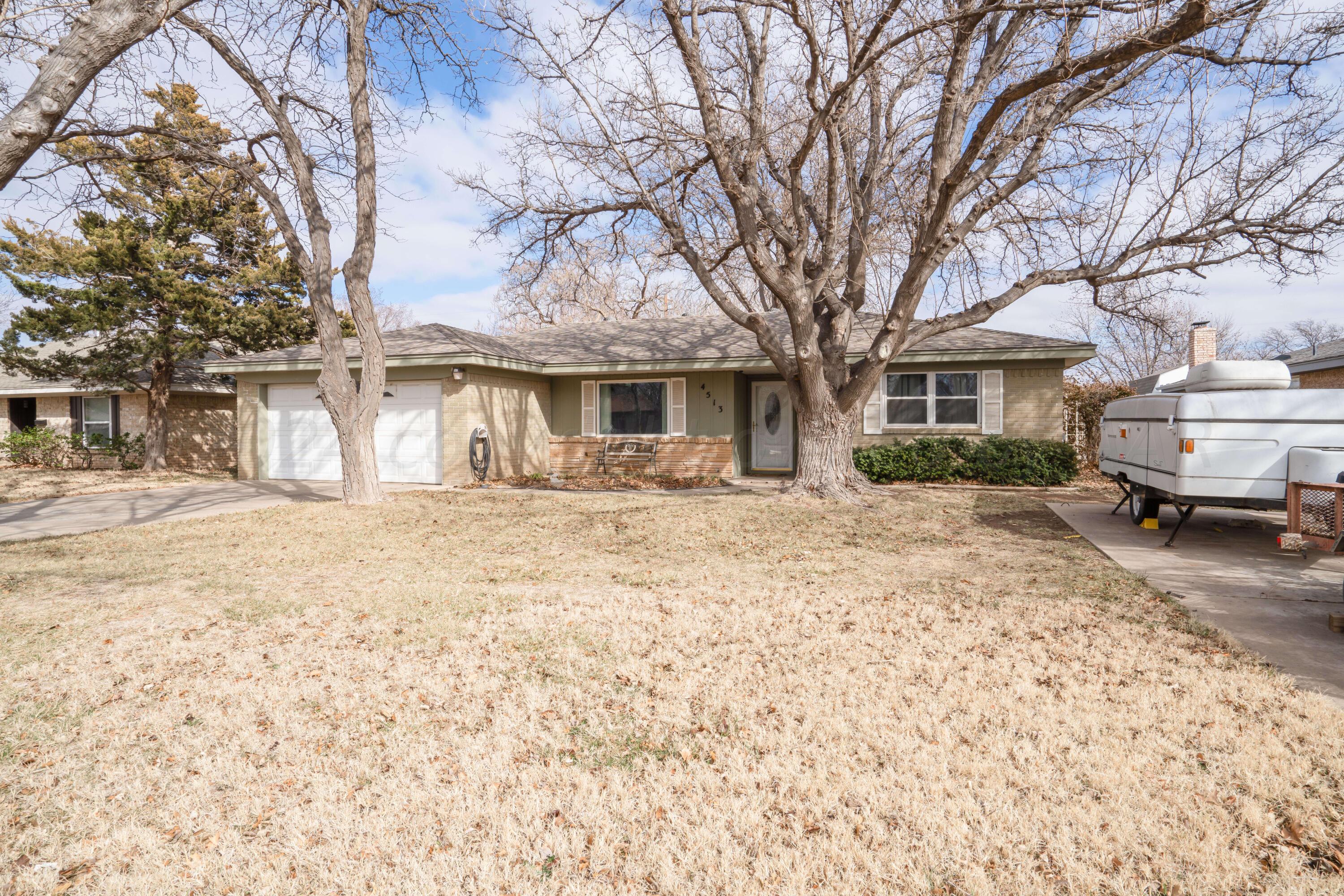 4513 Mesa Circle Amarillo, TX 79109 - Photo 18 of 18 a front view of a house with a yard