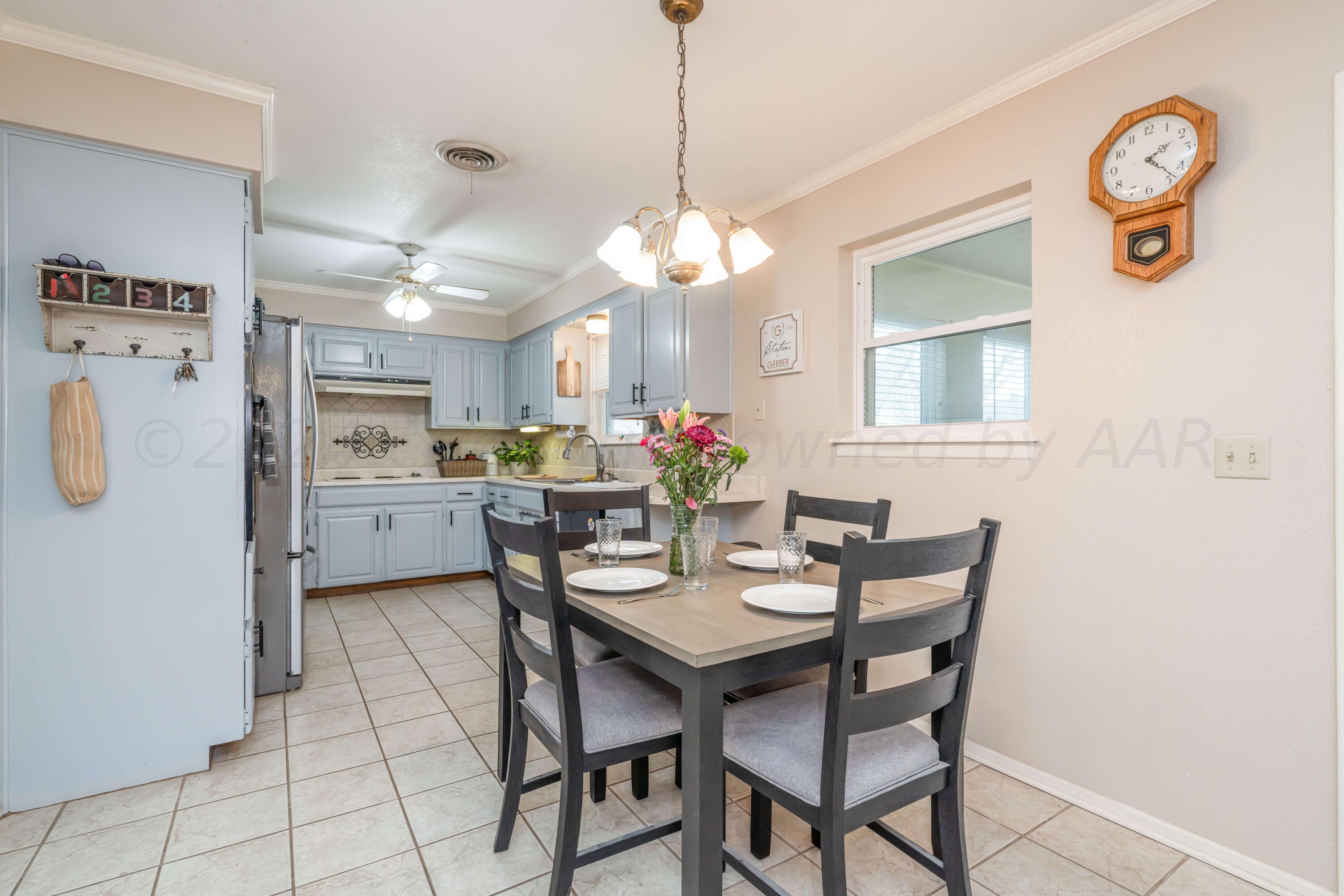 4513 Mesa Circle Amarillo, TX 79109 - Photo 2 of 18 a view of a dining room with furniture and chandelier