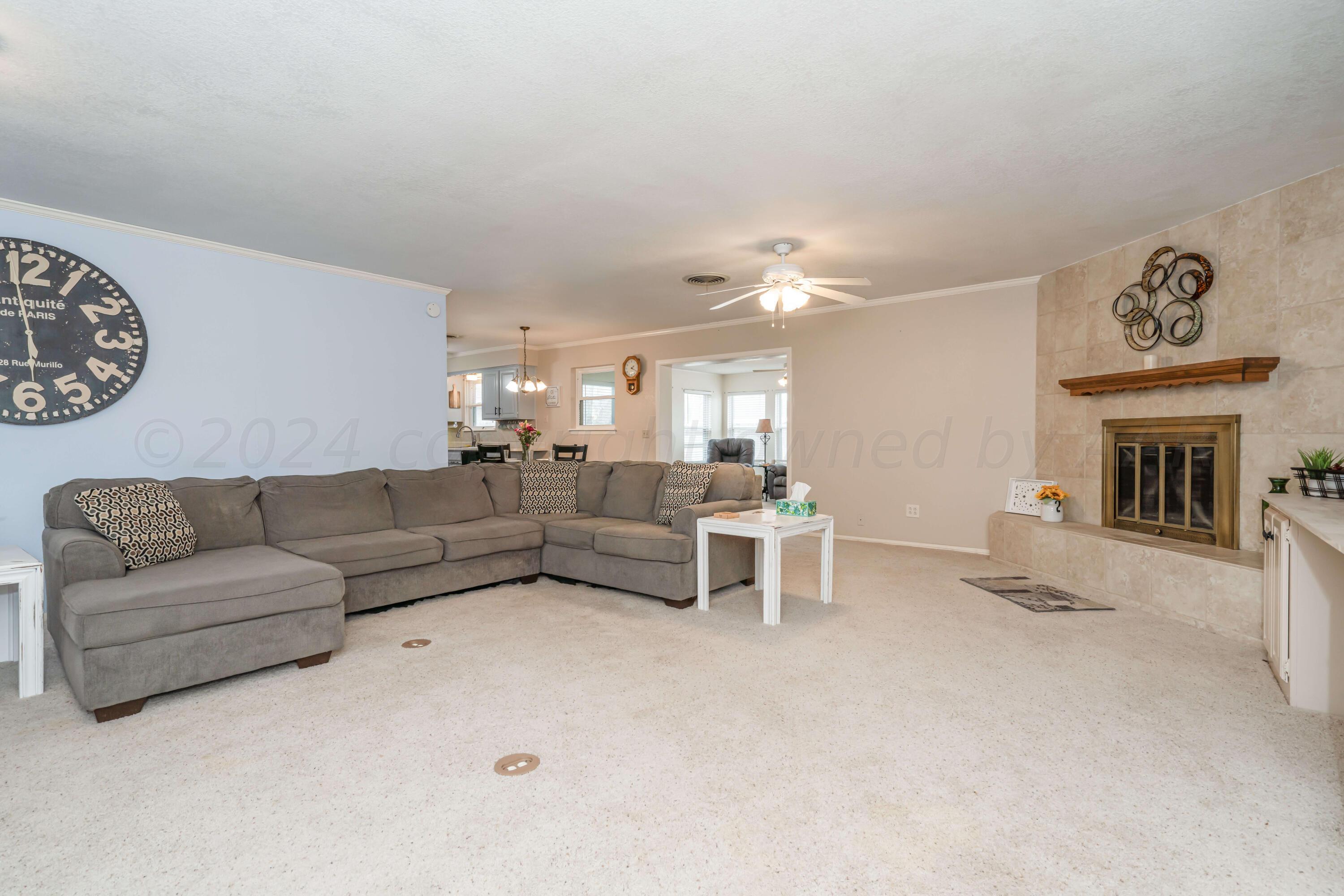 4513 Mesa Circle Amarillo, TX 79109 - Photo 3 of 18 a living room with furniture and a fireplace