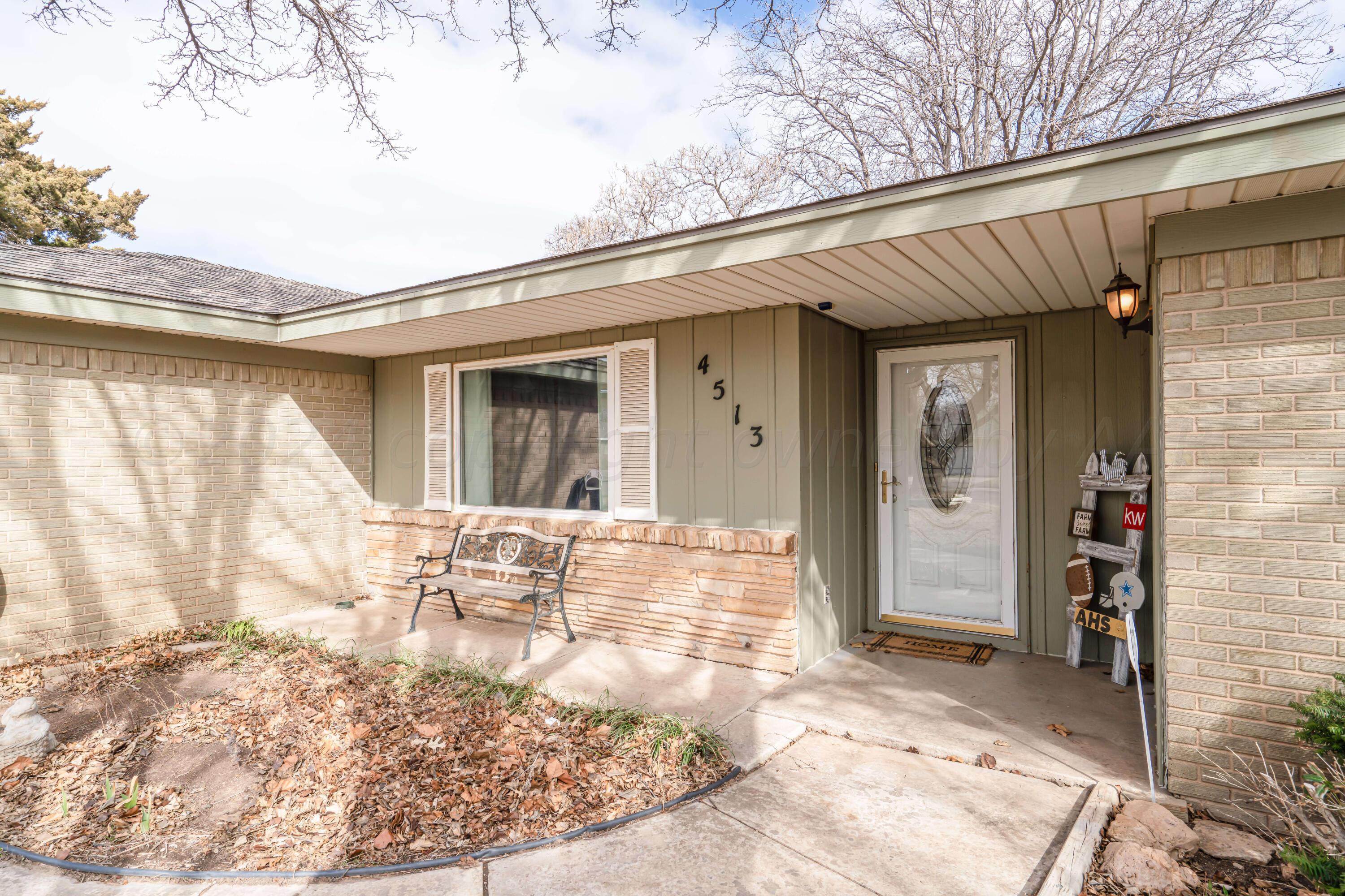 4513 Mesa Circle Amarillo, TX 79109 - Photo 7 of 18 a view of a patio with table and chairs and potted plants