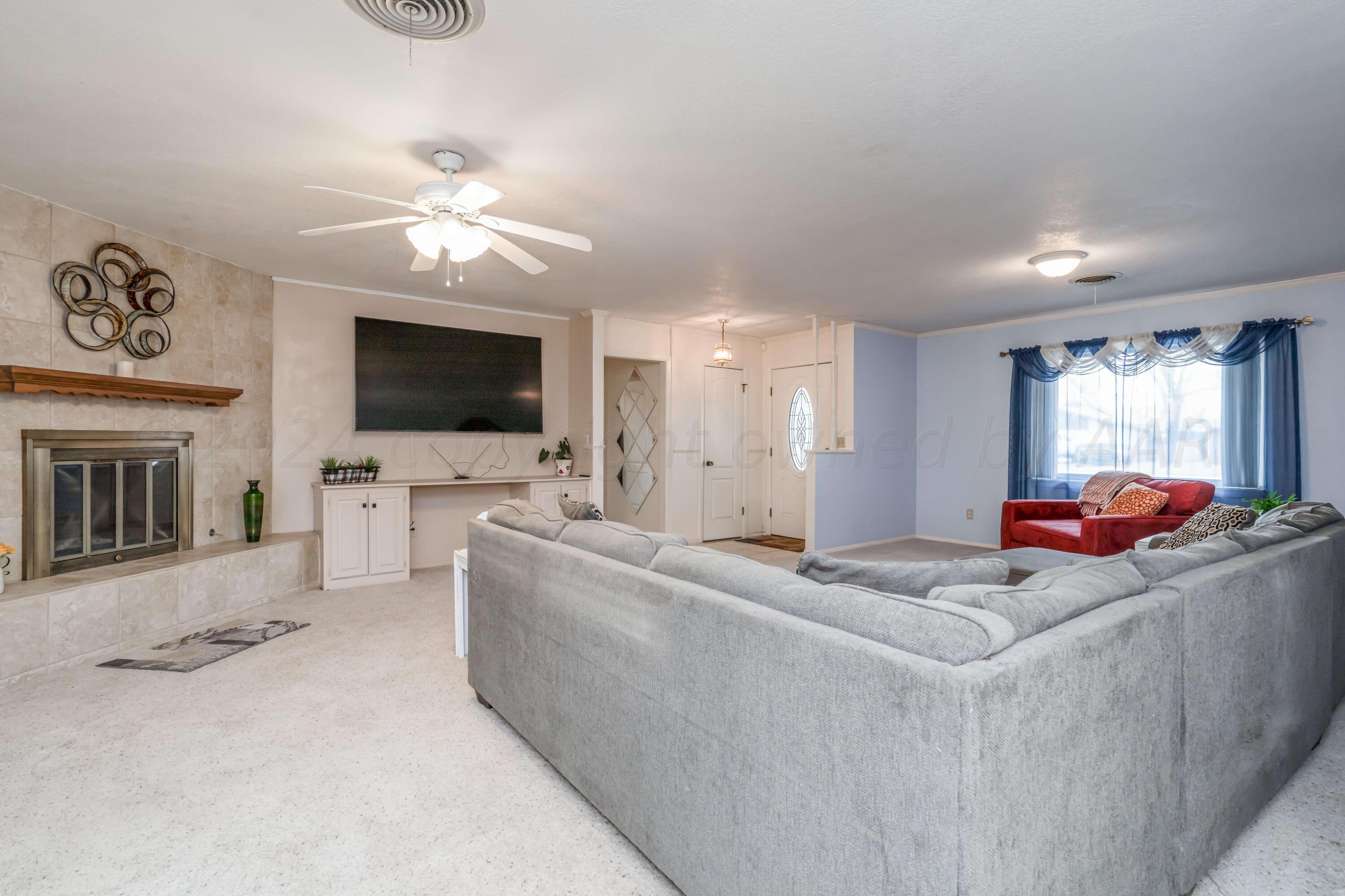 4513 Mesa Circle Amarillo, TX 79109 - Photo 8 of 18 a living room with furniture and a flat screen tv