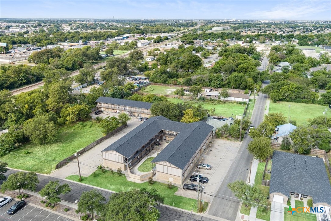 209 Root Avenue Killeen, TX 76541 - Photo 2 of 7 an aerial view of residential houses with outdoor space and trees