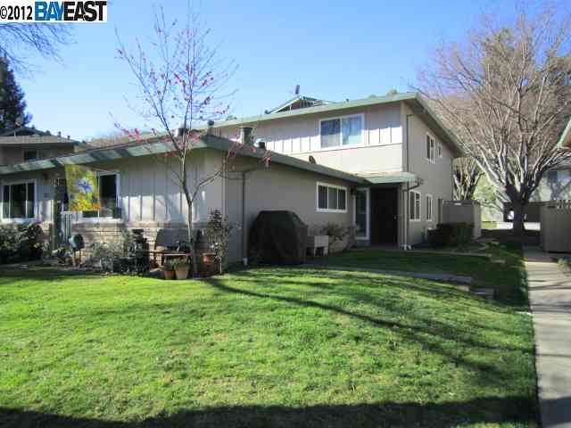 2228 Segundo Court, Unit 3 Pleasanton, CA 94588 - Photo 1 of 1 a front view of a house with a yard and porch