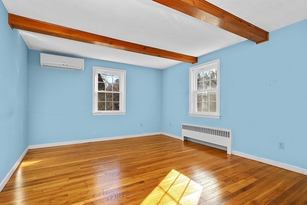 8 Autumn Lane Walpole, MA 02081 - Photo 11 of 28 a view of empty room with wooden floor and fan