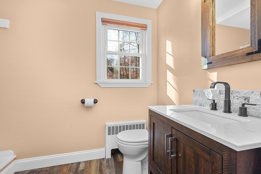 8 Autumn Lane Walpole, MA 02081 - Photo 13 of 28 a bathroom with a sink a toilet and a window