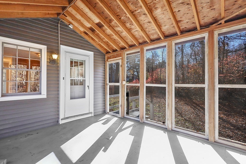 8 Autumn Lane Walpole, MA 02081 - Photo 21 of 28 a view of a porch with a table and chairs