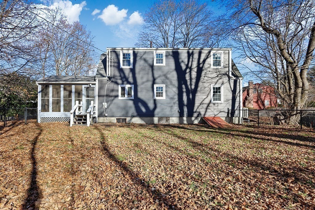 8 Autumn Lane Walpole, MA 02081 - Photo 24 of 28 a view of a house with a yard and large trees