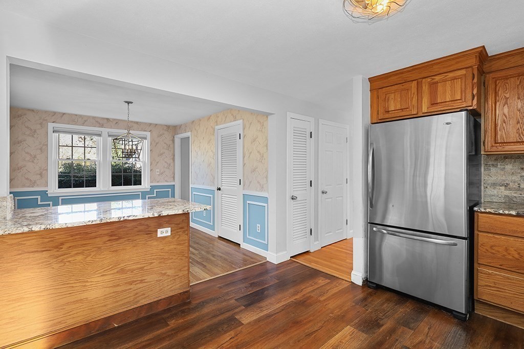 8 Autumn Lane Walpole, MA 02081 - Photo 6 of 28 a view of a kitchen with wooden floor and electronic appliances