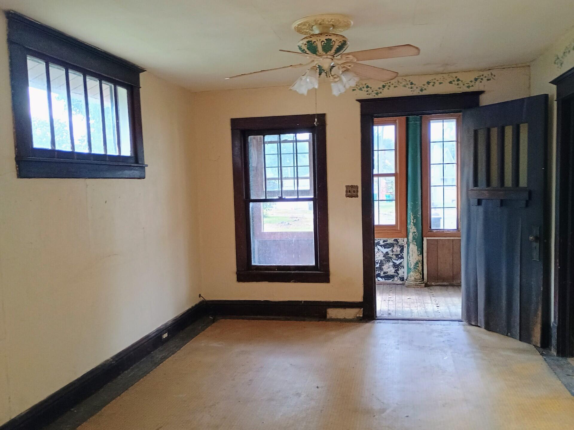 419 Main Street North Judson, IN 46366 - Photo 2 of 9 an empty room with windows