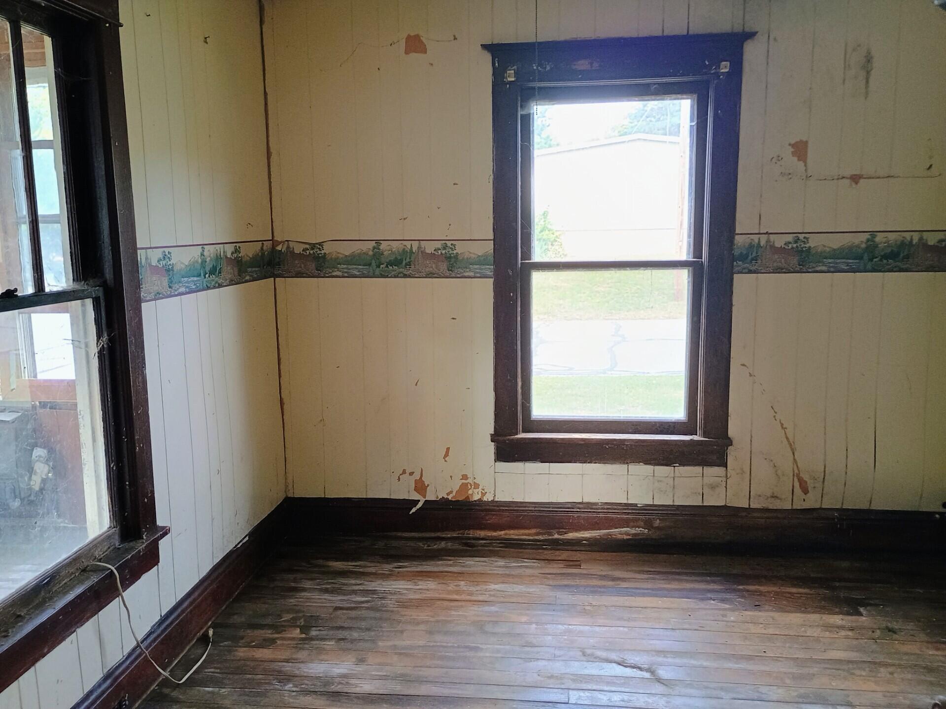 419 Main Street North Judson, IN 46366 - Photo 5 of 9 a view of a small space with wooden floor and a window