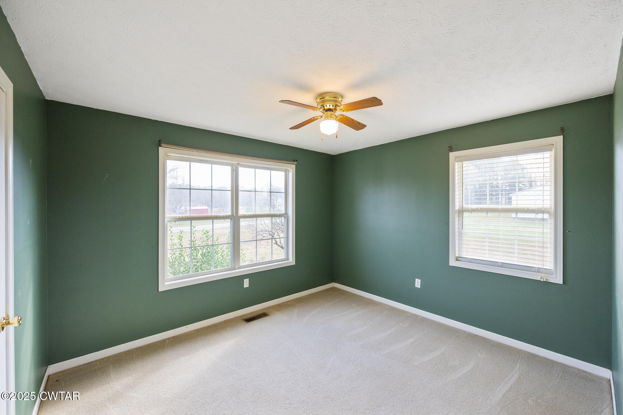 750 Northwind Loop Lexington, TN 38351 - Photo 17 of 33 an empty room with a window and a fan