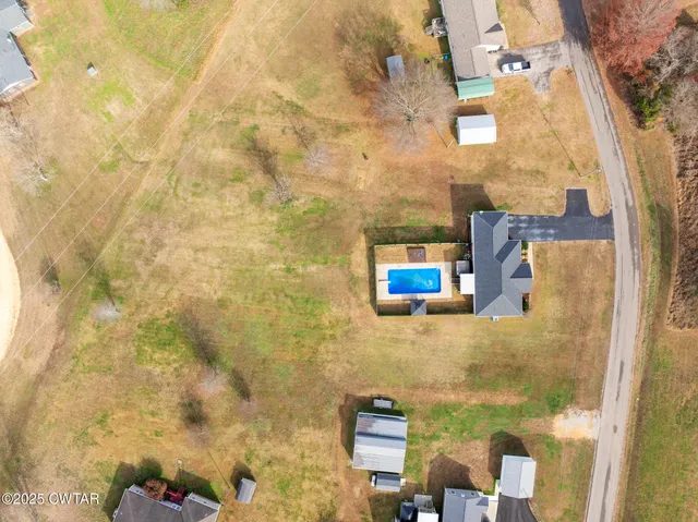 a front view of a house with a big yard