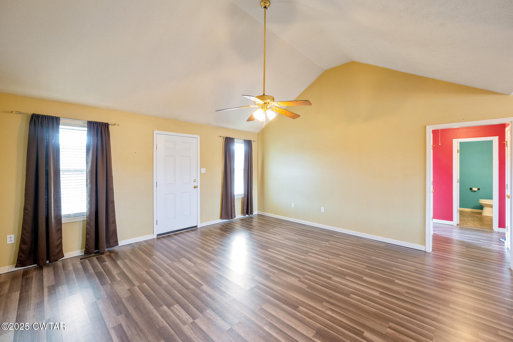 750 Northwind Loop Lexington, TN 38351 - Photo 7 of 33 a view of a room with wooden floor and a ceiling fan