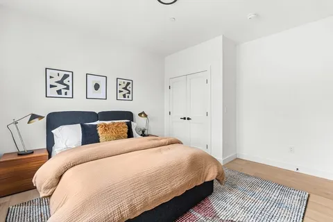 a bedroom with bed and a window