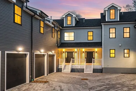 a view of a building with glass windows and door