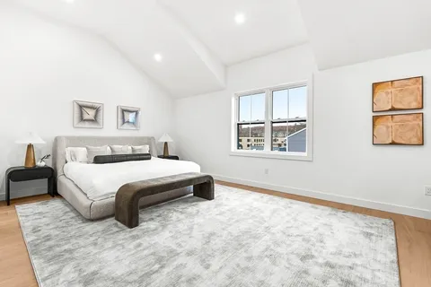 a bedroom with a bed and dresser