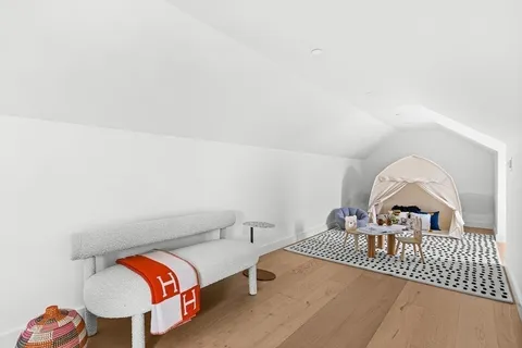 a white bath tub sitting next to a white toilet