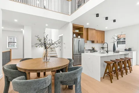 a view of a dining room with furniture and window
